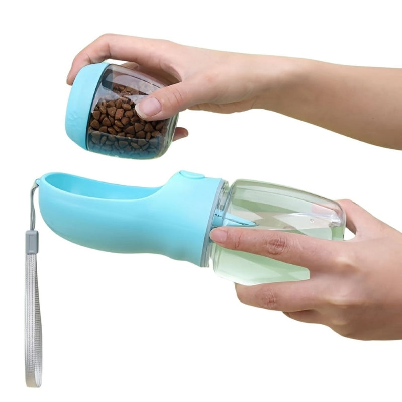 Portable dog water bottle and food container held by a person on a white background