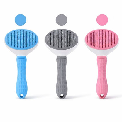 Pet grooming brush with ergonomic handle
