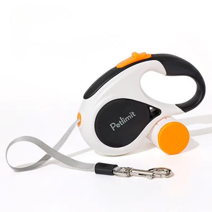 Retractable dog leash with black and orange handle on a white background