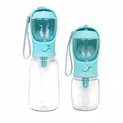 Two portable dog water bottles with blue lids and clear bodies on a white background