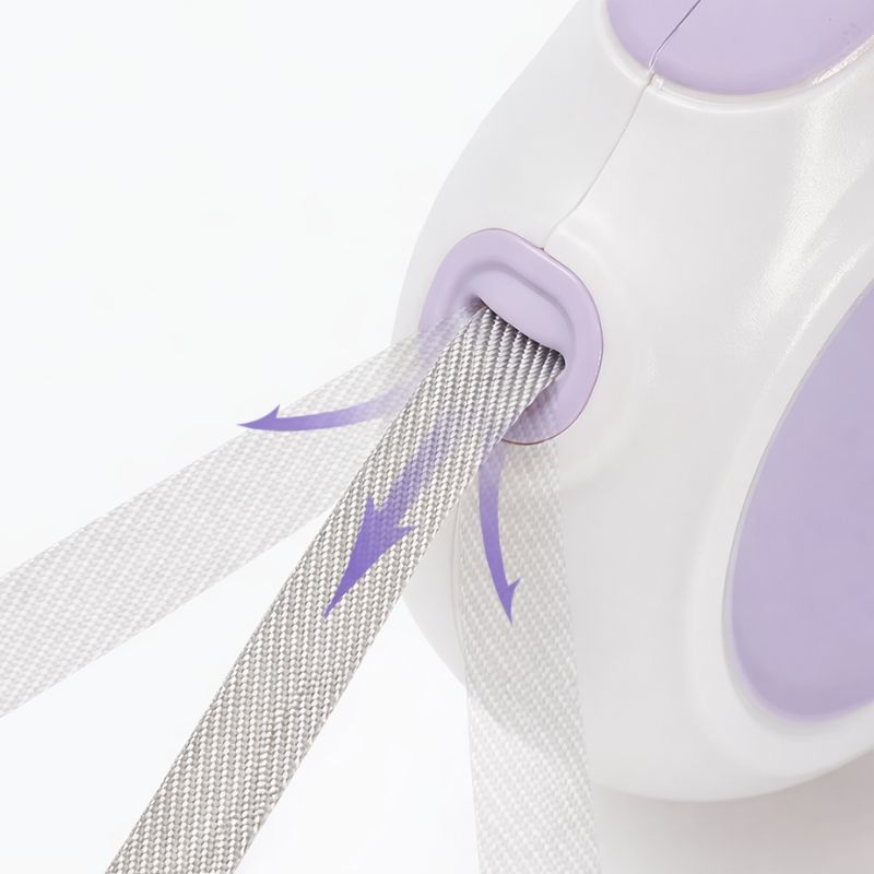 Close-up of a white and purple device with a strap, on a light gray background