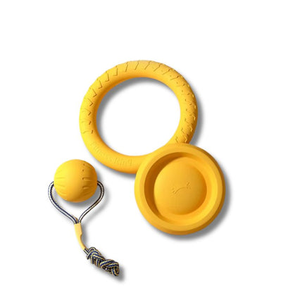 Yellow dog toy with ball and handle on a white background